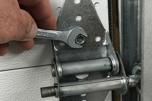 Tightening garage door hardware